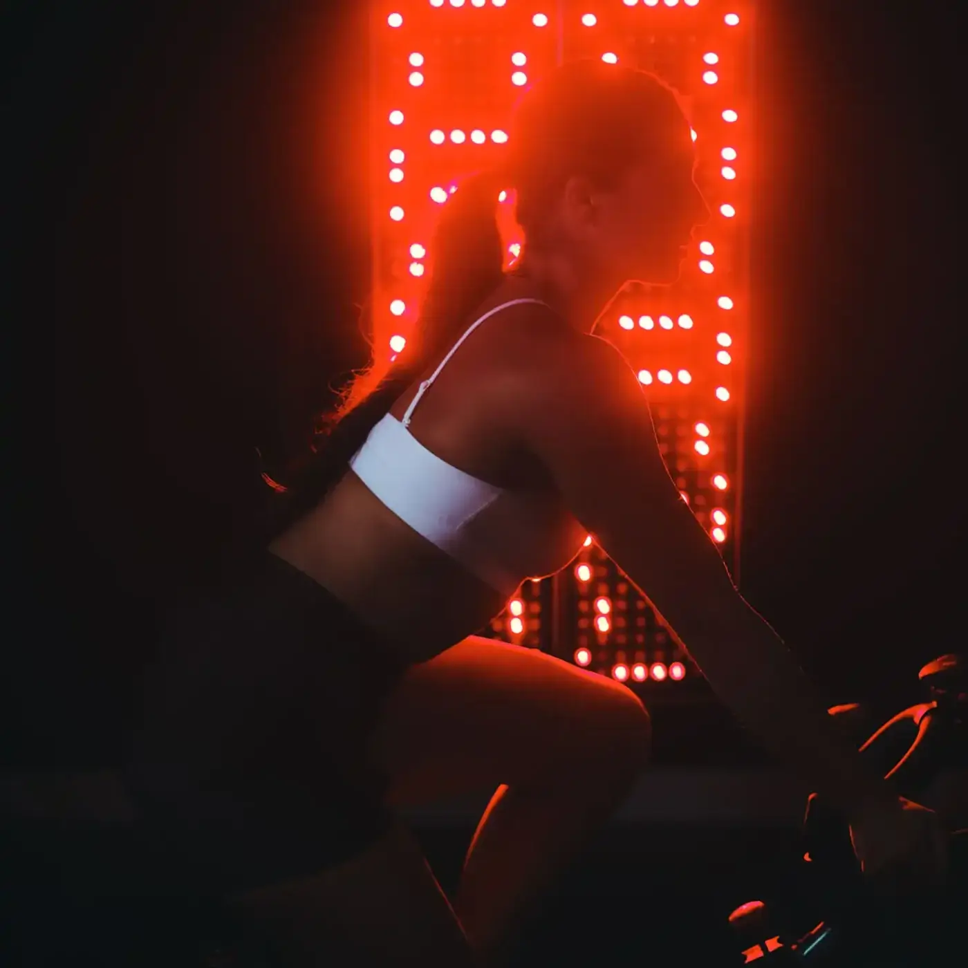 Patient using a TheraGo professional-grade portable red light therapy panel